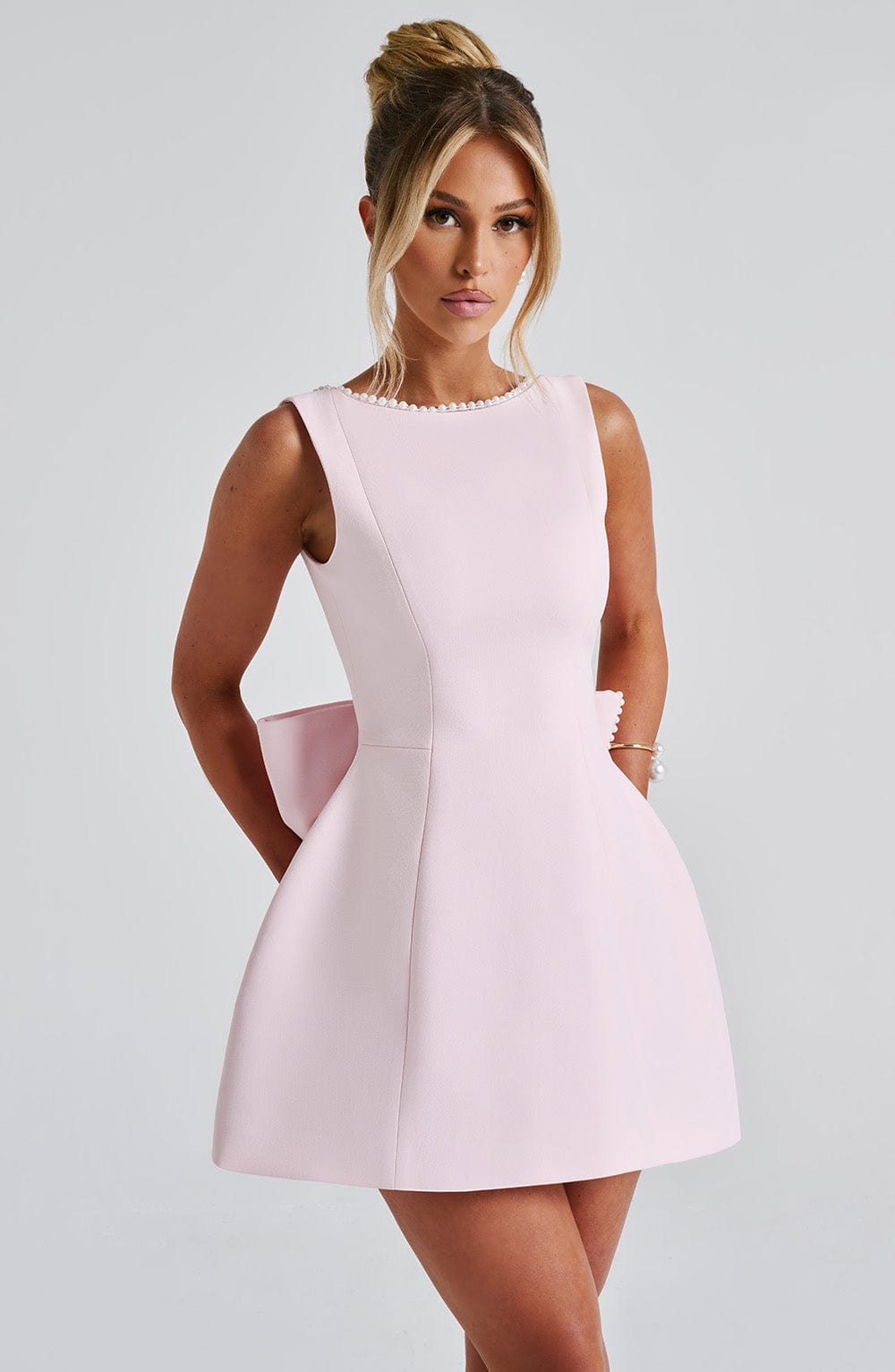 Elegant Pearl Trim Mini Dress for Women with Bateau Neck Sleeveless Bow Back Fit and Flare Cocktail Style