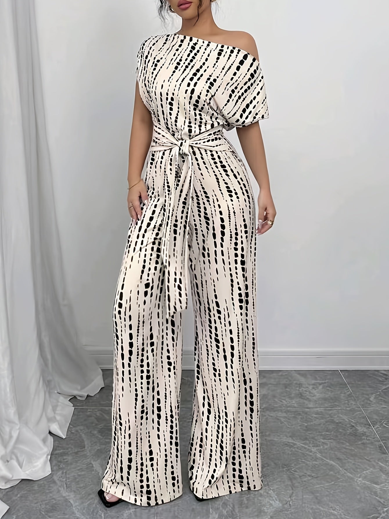 Elegant Apricot Abstract Print Jumpsuit for Women with One Shoulder Short Sleeve Belted Wide Leg Style